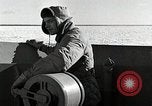 Image of USS Burton Island breaking way through ice in Bering Sea Bering Sea, 1952, second 37 stock footage video 65675077436
