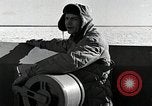 Image of USS Burton Island breaking way through ice in Bering Sea Bering Sea, 1952, second 38 stock footage video 65675077436