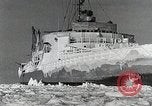 Image of USS Burton Island breaking way through ice in Bering Sea Bering Sea, 1952, second 43 stock footage video 65675077436