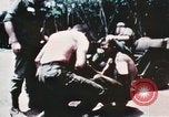 Image of medical aid via Huey helicopter and ambulance Vietnam, 1966, second 1 stock footage video 65675077440