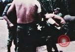 Image of medical aid via Huey helicopter and ambulance Vietnam, 1966, second 4 stock footage video 65675077440
