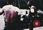 Image of medical aid via Huey helicopter and ambulance Vietnam, 1966, second 5 stock footage video 65675077440