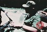 Image of medical aid via Huey helicopter and ambulance Vietnam, 1966, second 7 stock footage video 65675077440