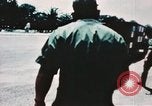 Image of medical aid via Huey helicopter and ambulance Vietnam, 1966, second 10 stock footage video 65675077440