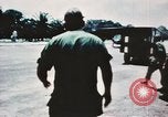 Image of medical aid via Huey helicopter and ambulance Vietnam, 1966, second 11 stock footage video 65675077440