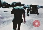 Image of medical aid via Huey helicopter and ambulance Vietnam, 1966, second 13 stock footage video 65675077440