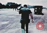 Image of medical aid via Huey helicopter and ambulance Vietnam, 1966, second 15 stock footage video 65675077440