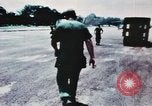 Image of medical aid via Huey helicopter and ambulance Vietnam, 1966, second 16 stock footage video 65675077440