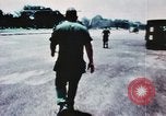 Image of medical aid via Huey helicopter and ambulance Vietnam, 1966, second 17 stock footage video 65675077440