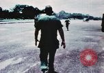 Image of medical aid via Huey helicopter and ambulance Vietnam, 1966, second 18 stock footage video 65675077440