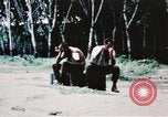 Image of medical aid via Huey helicopter and ambulance Vietnam, 1966, second 20 stock footage video 65675077440