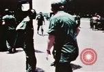 Image of medical aid via Huey helicopter and ambulance Vietnam, 1966, second 21 stock footage video 65675077440