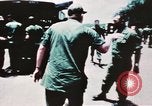 Image of medical aid via Huey helicopter and ambulance Vietnam, 1966, second 22 stock footage video 65675077440