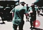 Image of medical aid via Huey helicopter and ambulance Vietnam, 1966, second 23 stock footage video 65675077440
