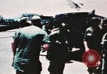 Image of medical aid via Huey helicopter and ambulance Vietnam, 1966, second 26 stock footage video 65675077440