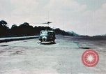 Image of medical aid via Huey helicopter and ambulance Vietnam, 1966, second 32 stock footage video 65675077440