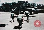 Image of medical aid via Huey helicopter and ambulance Vietnam, 1966, second 37 stock footage video 65675077440