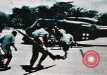 Image of medical aid via Huey helicopter and ambulance Vietnam, 1966, second 38 stock footage video 65675077440