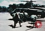 Image of medical aid via Huey helicopter and ambulance Vietnam, 1966, second 39 stock footage video 65675077440