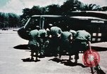 Image of medical aid via Huey helicopter and ambulance Vietnam, 1966, second 40 stock footage video 65675077440