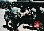Image of medical aid via Huey helicopter and ambulance Vietnam, 1966, second 42 stock footage video 65675077440