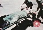 Image of medical aid via Huey helicopter and ambulance Vietnam, 1966, second 46 stock footage video 65675077440