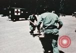 Image of medical aid via Huey helicopter and ambulance Vietnam, 1966, second 48 stock footage video 65675077440