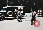 Image of medical aid via Huey helicopter and ambulance Vietnam, 1966, second 49 stock footage video 65675077440