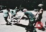 Image of medical aid via Huey helicopter and ambulance Vietnam, 1966, second 59 stock footage video 65675077440