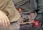 Image of wounded Marine Iwo Jima, 1945, second 12 stock footage video 65675077474