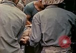 Image of wounded Marine Iwo Jima, 1945, second 37 stock footage video 65675077474