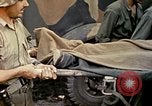 Image of wounded Marine Iwo Jima, 1945, second 54 stock footage video 65675077474