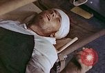 Image of wounded Marines Saipan Northern Mariana Islands, 1945, second 51 stock footage video 65675077541