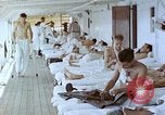 Image of wounded Marines Pacific Ocean, 1945, second 1 stock footage video 65675077542
