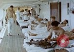 Image of wounded Marines Pacific Ocean, 1945, second 3 stock footage video 65675077542