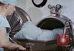 Image of wounded Marines Pacific Ocean, 1945, second 11 stock footage video 65675077542
