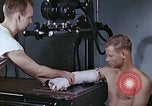 Image of wounded Marines Pacific Ocean, 1945, second 13 stock footage video 65675077542