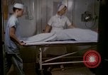 Image of wounded Marines Pacific Ocean, 1945, second 15 stock footage video 65675077542