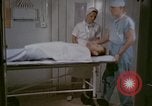 Image of wounded Marines Pacific Ocean, 1945, second 16 stock footage video 65675077542