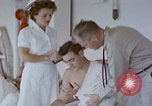 Image of wounded Marines Pacific Ocean, 1945, second 18 stock footage video 65675077542