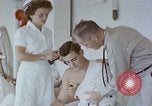 Image of wounded Marines Pacific Ocean, 1945, second 19 stock footage video 65675077542