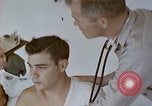 Image of wounded Marines Pacific Ocean, 1945, second 21 stock footage video 65675077542