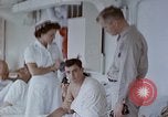 Image of wounded Marines Pacific Ocean, 1945, second 28 stock footage video 65675077542