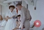 Image of wounded Marines Pacific Ocean, 1945, second 29 stock footage video 65675077542
