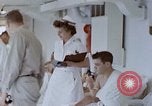 Image of wounded Marines Pacific Ocean, 1945, second 30 stock footage video 65675077542