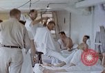 Image of wounded Marines Pacific Ocean, 1945, second 32 stock footage video 65675077542
