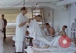 Image of wounded Marines Pacific Ocean, 1945, second 35 stock footage video 65675077542