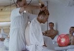 Image of wounded Marines Pacific Ocean, 1945, second 36 stock footage video 65675077542