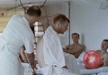 Image of wounded Marines Pacific Ocean, 1945, second 39 stock footage video 65675077542