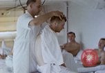 Image of wounded Marines Pacific Ocean, 1945, second 41 stock footage video 65675077542